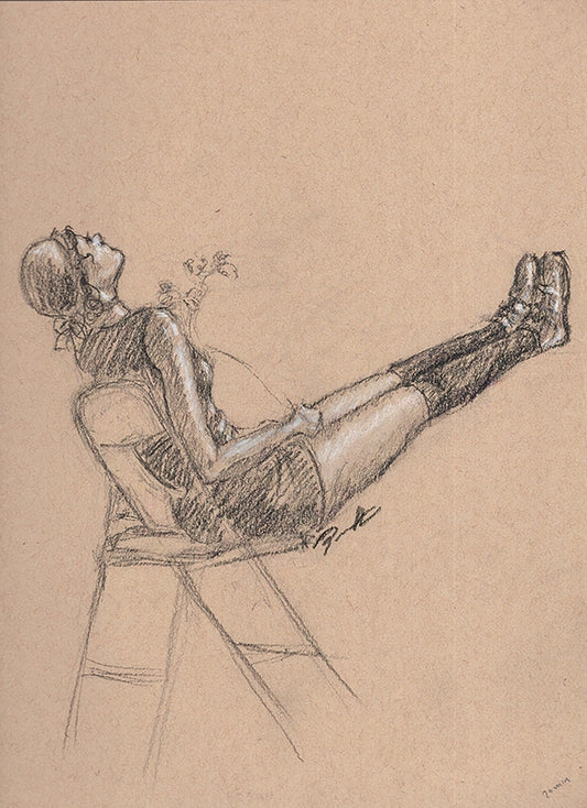 Black and white charcoal drawing on toned paper of a female figure drawn from a live model. The lady is reclining with her legs up.