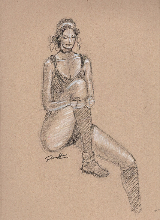 Black and white charcoal sketch on toned paper of a female figure drawn from a live model. The woman is seated with one leg bent stretching.